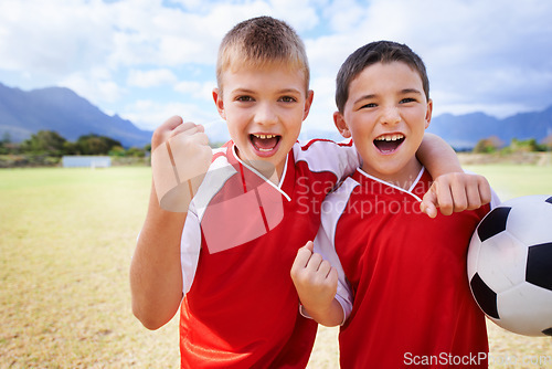 Image of Happy boy, portrait and friends fist pump for soccer, winning or celebration on outdoor field. Excited male person, children or kids smile for football, victory or friendly game together in nature