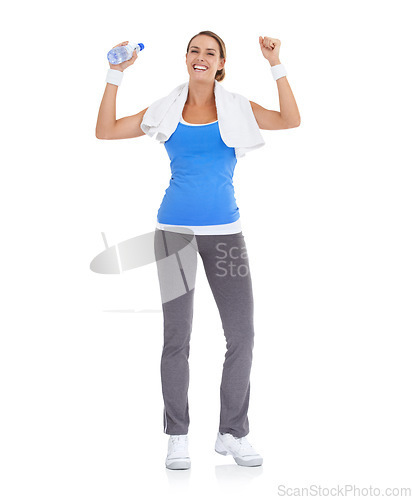 Image of Woman, fist and water bottle for fitness in studio with exercise, workout success or body goals and achievement. Portrait of model with fist, energy and training celebration on a white background