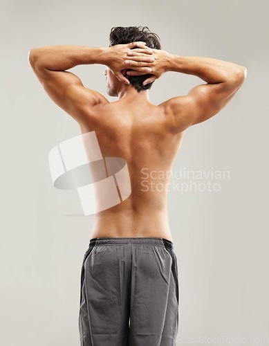 Image of Back, topless or model for fitness results, wellness and health isolated on grey background in studio. Hands up, man or male person with progress in exercise, workout and training on a backdrop alone