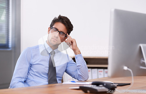 Image of Businessman at desk, thinking or planning with research, ideas and doubt for problem solving. Corporate, confused and professional consultant in workplace for project vision, choice and solution