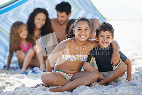 Image of Girl, boy with family on beach and smile in portrait, summer vacation with hug, bonding and love. People outdoor, holiday in Brazil with sand and sun, children happy for travel and adventure together