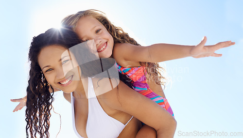 Image of Happy mother, portrait and child piggyback on beach for bonding, vacation or outdoor holiday weekend together. Mom, kid or daughter smile in sun or hug for love, support or summer break with blue sky