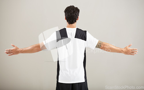 Image of Back, athlete or model for fitness results, wellness and health isolated on grey background in studio. Arms out, man or male person with progress in exercise, workout and training on a backdrop alone