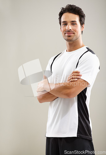 Image of Arms crossed, portrait or athlete in studio for fitness workout, sports exercise or healthy wellness. Mockup space, grey background or man ready to start training with confidence, discipline or pride