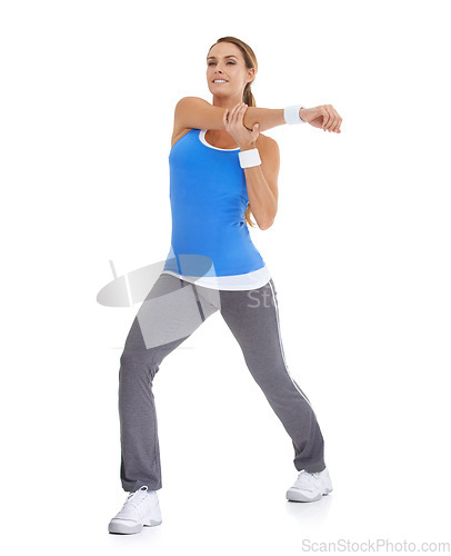 Image of Sports, health and woman stretching in studio for arm exercise, training or workout. Fitness, smile and young female person with muscle warm up for wellness activity isolated by white background.
