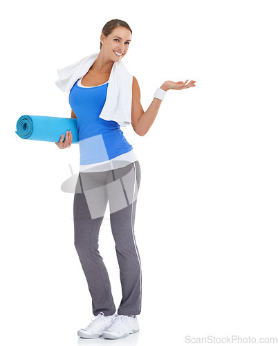 Image of Yoga mat, hand and portrait of woman in studio with mockup space for exercise or workout. Happy, equipment and young female person with show gesture for fitness or sports isolated by white background