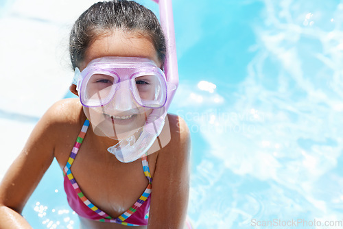Image of Pool, smile and portrait of child with goggles for swimming lesson, activity or hobby fun. Happy, snorkeling and girl kid with equipment for skill or tricks in water of outdoor backyard at home.