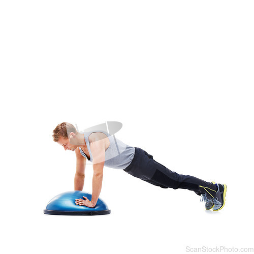 Image of Man, fitness and half ball for plank in studio for training, strong exercise and gym with muscle health on floor. Person or young sports model in shoulder or arms workout on a white background