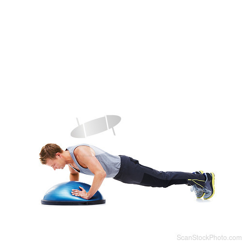 Image of Man, training and half ball for plank in studio for fitness, strong exercise and gym with muscle health on floor. Bodybuilder or young sports model with push up or arms workout on a white background