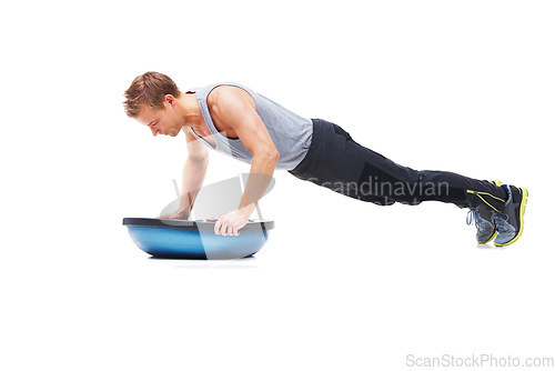 Image of Man, fitness and half ball for push up in studio for workout, strong exercise and gym with muscle health on floor. Bodybuilder or young sports model with plank or arms training on a white background