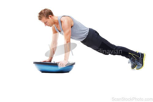 Image of Man, training and half ball for push up in studio for workout, strong exercise and gym with muscle health on floor. Bodybuilder or sports model in plank or arms fitness balance on a white background