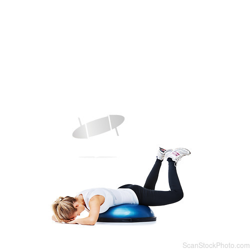 Image of Woman, bosu ball and lying in fitness for balance, exercise or workout on a white studio background. Young active female person or athlete on half round object for health and wellness on mockup space