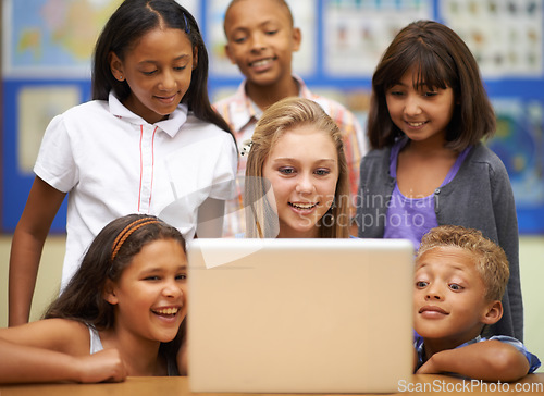 Image of Children, students and computer in classroom for education, learning and video streaming with group project. Happy diversity kids and girl with leadership on laptop at school for online information