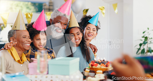 Image of Cake, happy and family at birthday party celebration together at modern house with candles. Smile, excited and young children with African father and grandparents with hats for photograph at home.