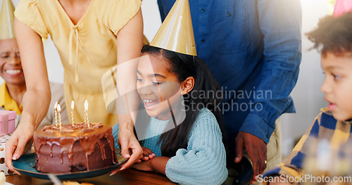 Image of Cake, smile and family at birthday party celebration together at modern house with candles and hat. Happy, excited and young children with parents and grandparents for sweet dessert at home.