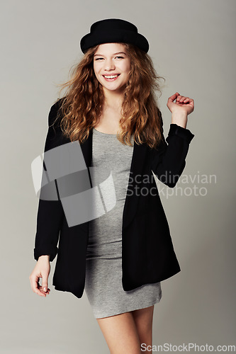 Image of Happy, portrait and woman with vintage fashion, style and aesthetic in grey background of studio. Confident, smile and girl with pride in unique or retro clothing with model in hat for trendy outfit