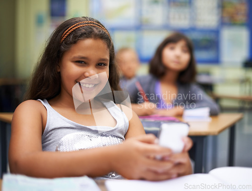 Image of School, students or portrait of girl with phone for texting, gossip or message notification in classroom. News, sharing or happy child with a meme on mobile app or social media for online distraction