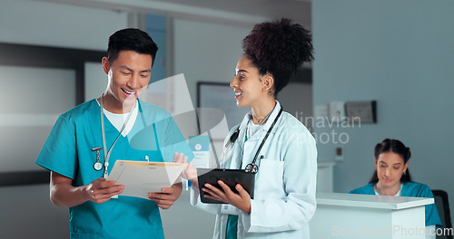 Image of Doctor, hospital and chart for discussion, colleague and tablet for consultation, medical data and cure. Healthcare, collaboration or work in clinic, man and woman with patient update, help or advice