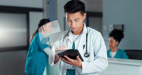 Image of Tablet, healthcare doctor and happy man typing online research, check medicine study and smile for wellness results. Hospital service, happiness and surgeon reading clinic review, feedback or news