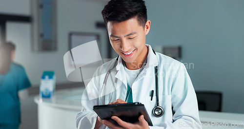 Image of Tablet, healthcare doctor and happy man typing online research, check medicine study and smile for wellness results. Hospital service, happiness and surgeon reading clinic review, feedback or news