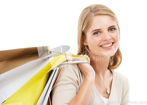 Image of Portrait, woman and smile with shopping bag in studio for retail sales, financial freedom and commerce savings white background. Happy customer with gift bags for deal, discount and mockup promotion