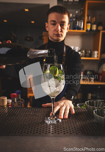 Image of Bartender pouring champagne