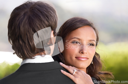 Image of Couple, dancing and embrace on wedding day for love, support and excited for marriage and commitment. People, romance and hugging at outdoor ceremony, loyalty and pride for ring and partnership