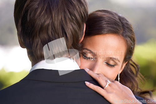 Image of Couple, union and embrace on wedding day for love, support and together for marriage and commitment. People, romance and hugging at outdoor ceremony, loyalty and ring for devotion and partnership