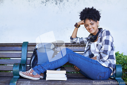 Image of Woman, portrait and university bench with book for diploma study, education or reading. Female person, face and student at college campus or outdoor for knowledge, scholarship or research literature