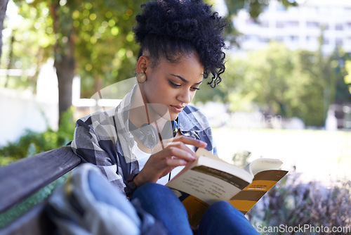 Image of Woman, student and reading on bench with book for university study, learn education or relax. Female person, academic and college campus or outdoor for knowledge, scholarship or research literature