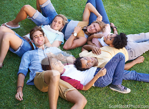 Image of Friends, group and grass or lying in circle in park or university relax, student peers or happy. Man, woman and portrait in nature or diversity on college campus or summer rest, weekend or connection