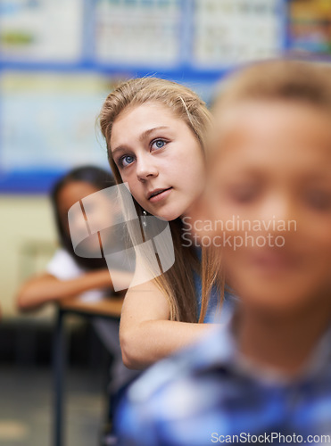 Image of Girl, classroom and writing for learning, elementary school and diverse children workbook. Students, study and childhood development for education, knowledge and academic information for people