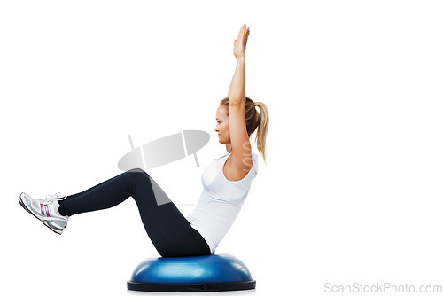 Image of Woman, half ball and sitting in fitness, balance or exercise on a white studio background. Young active female person or athlete on half round object in training, health and wellness on mockup space
