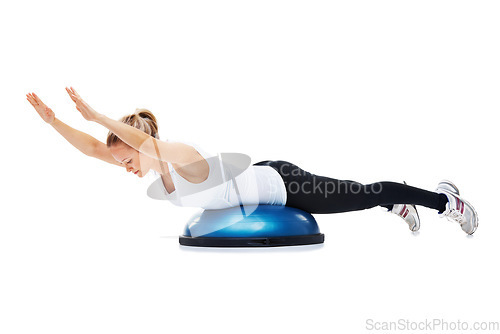 Image of Sports, bosu ball and woman stretching in a studio for body workout or training with balance. Fitness, equipment and young female person with muscle warm up exercise isolated by white background.