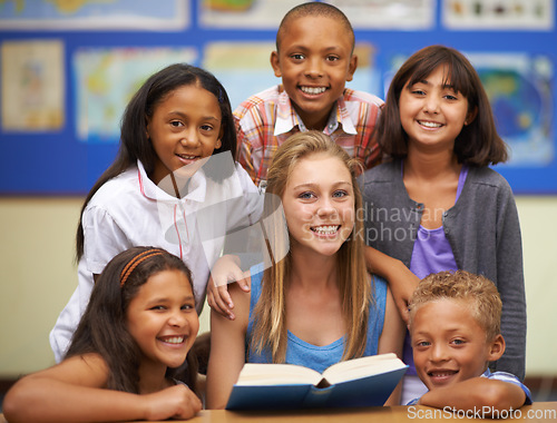 Image of Children, tutor and portrait with group in classroom for knowledge, learning or education with happiness. Face, student and woman at school with study, textbook and smile with diversity at college