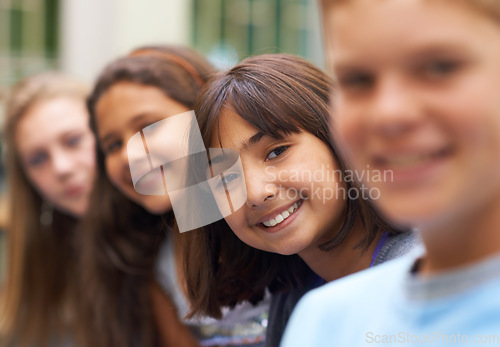 Image of Girl, portrait and confidence in corridor at school or happy and pride for learning, education or knowledge. Student, person or face with smile in building or hallway before class or ready to study
