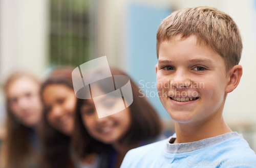 Image of Boy, portrait and happy outdoor at school with confidence and pride for learning, education or knowledge. Student, person and face with smile in building or college before class or ready to study