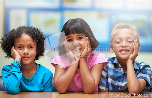 Image of Students, friends and portrait or happiness in classroom for learning, knowledge or education at desk. Kids, face and smile at academy or school with confidence or pride for development and diversity