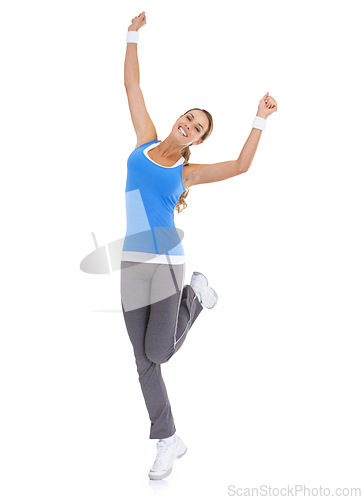 Image of Woman, workout celebration and yes in studio for exercise, fitness achievement and body goals or dance. Sports model with fist, energy or surprise portrait for training results on a white background