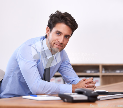 Image of Businessman, portrait and confident professional in office, relaxing and career pride in workplace. Male person, face and startup or entrepreneur, positive and planning for future company at desk