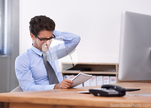 Image of Business man, stress and writing in notebook, contemplating ideas and notes in workplace. Male professional, frustrated and planning for schedule or strategy, mental health and journal or info