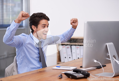 Image of Business man, celebration and computer for win in office, promotion and online competition or giveaway. Male professional, fist pump and career achievement, success and announcement or information