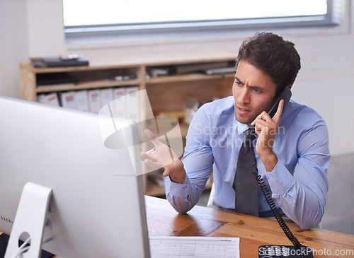 Image of Business man, phone call and stress on landline in workplace, contact and consulting or networking. Male professional, frustrated and communication or discussion, technology and confusion for info