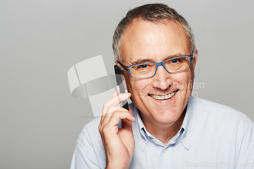 Image of Phone call, portrait and senior businessman in a studio with pride for legal corporate career. Glasses, smile and professional elderly male lawyer on mobile discussion isolated by gray background.