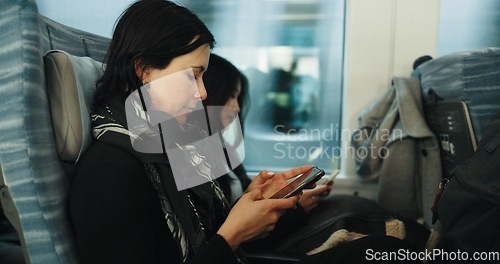 Image of Women, reading and train by smartphone on social media and public transport on metro bullet in japan. Friends, cellphone or diversity on fast vehicle on weekend trip or commute in tokyo on adventure