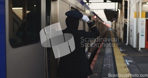 Image of Train, platform and conductor at station for travel, commute and journey on railway transportation. Public transport, underground railroad service and back of man for departure, arrival and subway