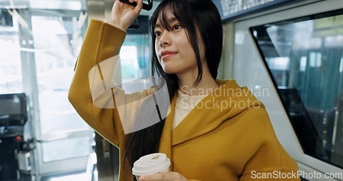 Image of Bus, morning and Japanese woman with student commute, travel and public transportation in city. Waiting, transport and traveler on a journey on a metro in town with coffee and thinking on a drive