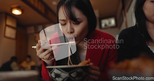 Image of Woman, restaurant and eating ramen noodles for nutrition, gourmet dining or meal with friends. Hungry lady, chopsticks or spaghetti for lunch, dinner or Japanese cuisine, fast food diner or cafeteria