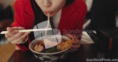 Image of Woman, mouth and eating ramen in restaurant for dinner, meal and noodles in cafeteria. Closeup, hungry lady and chopsticks for bowl of spaghetti, Japanese cuisine and lunch break in fast food diner
