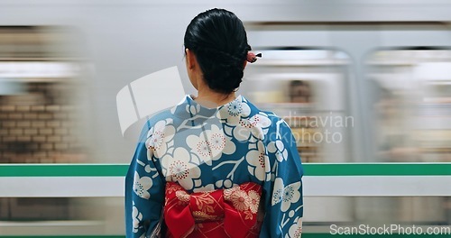 Image of Woman, Japanese train station and kimono traditional dress for transport, journey or metro railway. Commute, motion blur and travelling on urban platform, locomotive in Tokyo and female person